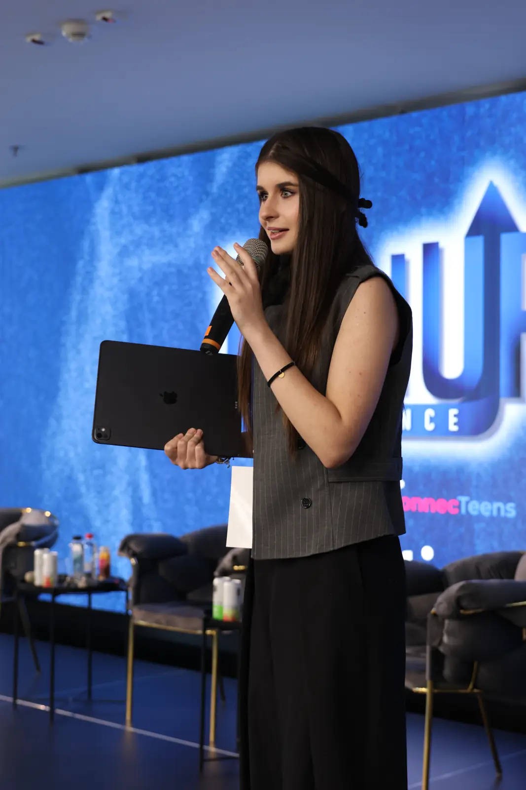 Sophia speaking on stage at the LeadUP conference